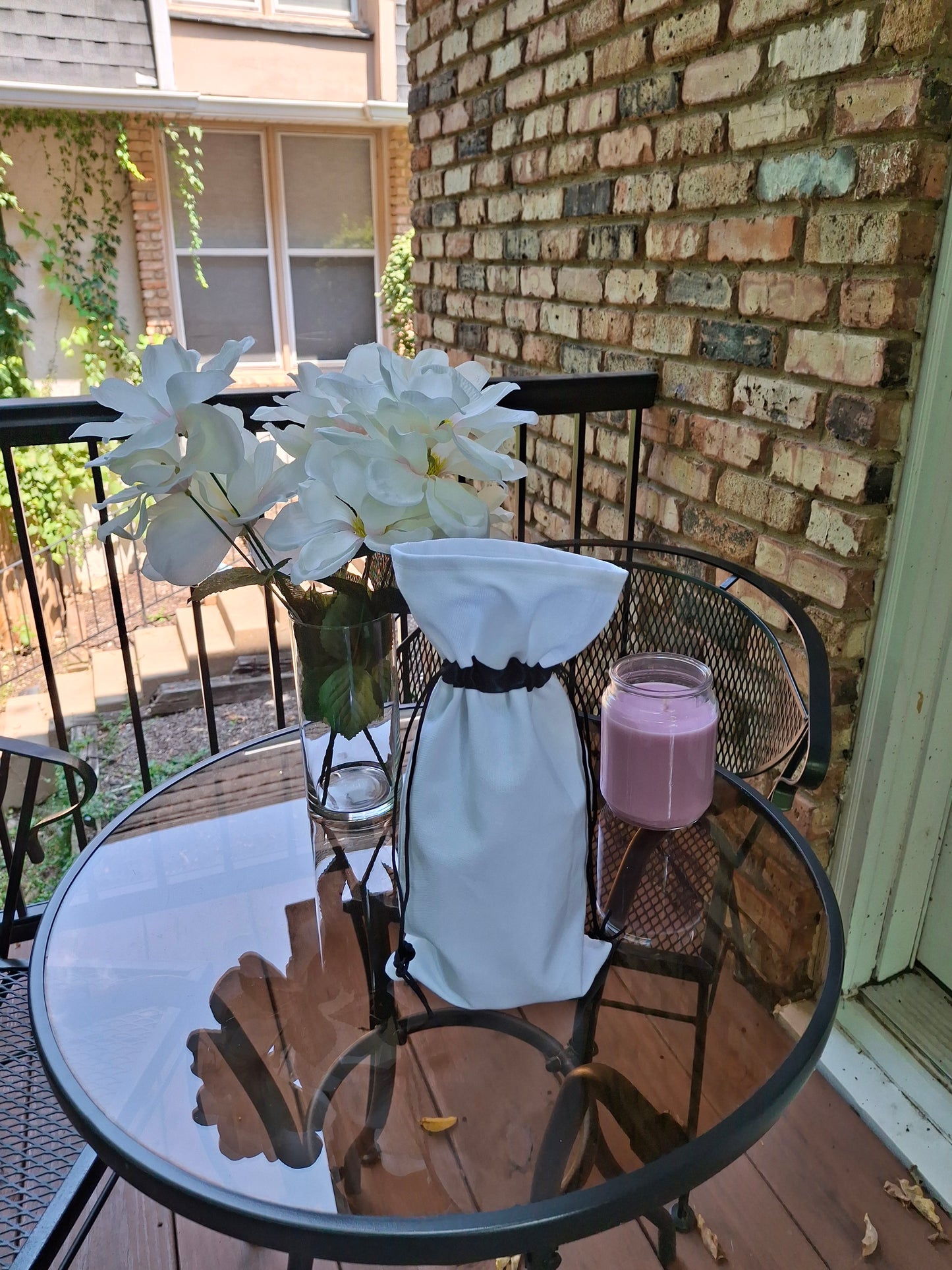 White canvas wine gift bag with black drawstring ribbon, customizable for gifts and special occasions