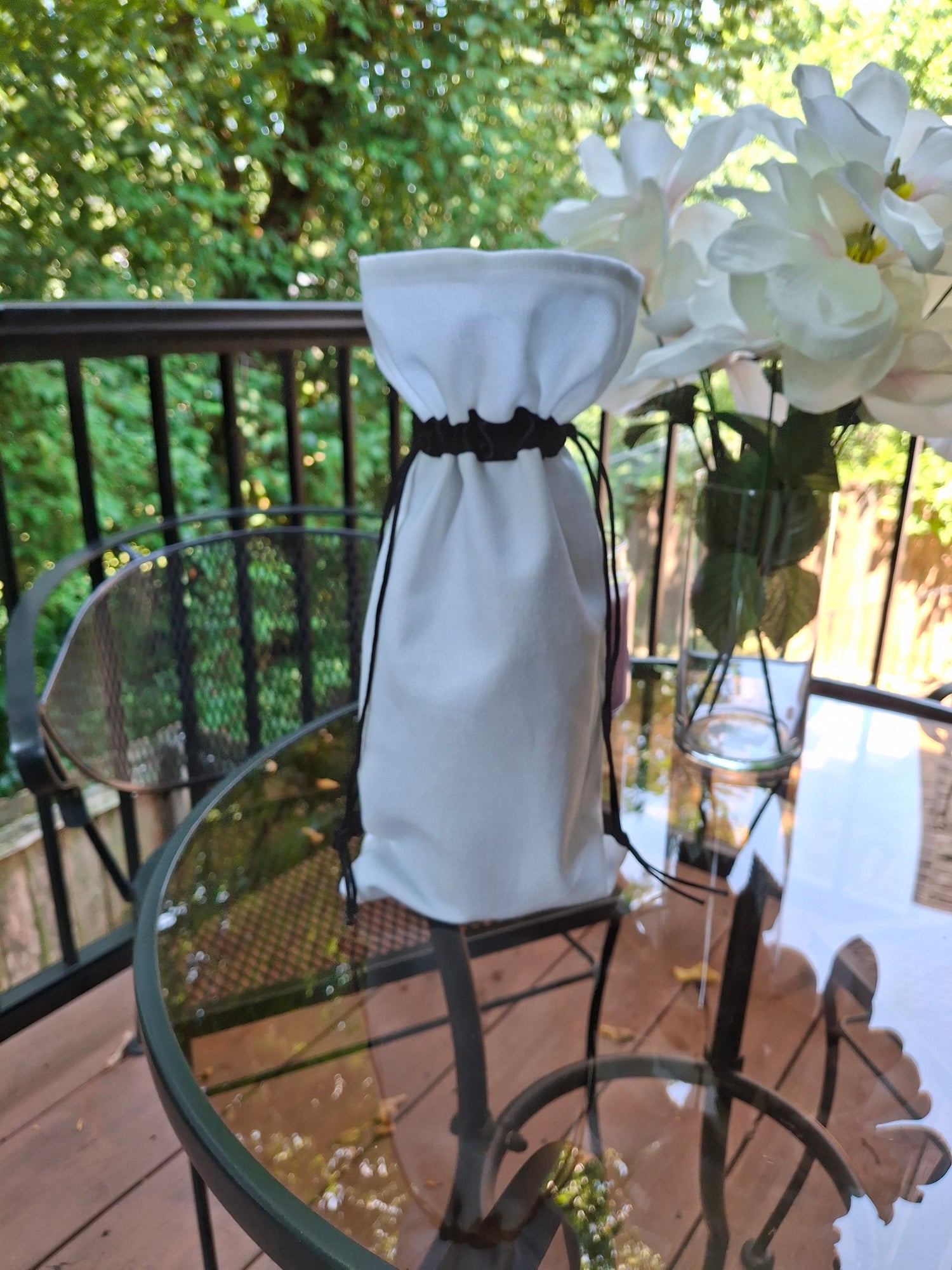 White canvas wine gift bag with black drawstring ribbon, customizable for gifts and special occasions